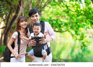 Happy Asian Family Hiking In Forest And Jungle