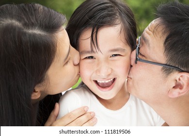 Happy Asian Family In Kissing