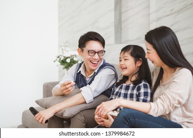 Happy Asian Family Lifestyle Enjoy Watching TV At Home