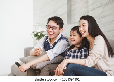 Happy Asian Family Lifestyle Enjoy Watching TV At Home