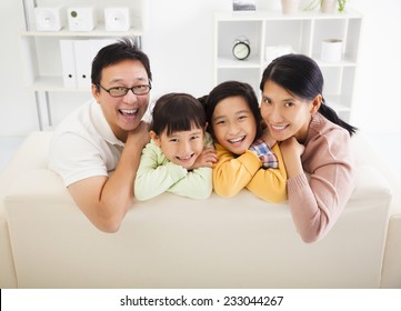 Happy Asian Family In The Living Room