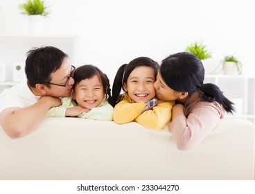 Happy Asian Family In The Living Room