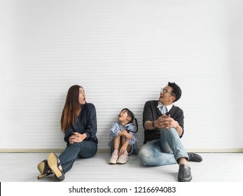 Happy Asian Family Looking Up. Copy Space.