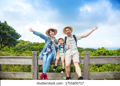 Happy Asian Family On Hiking Adventure