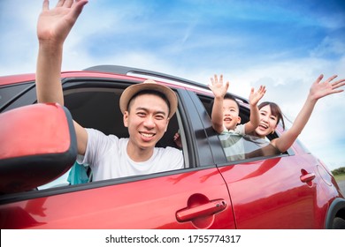 Happy Asian Family On  Road Trip In The Car