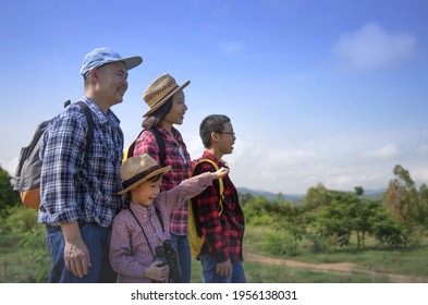 Happy Asian Family On A Trekking Day In The Mountain