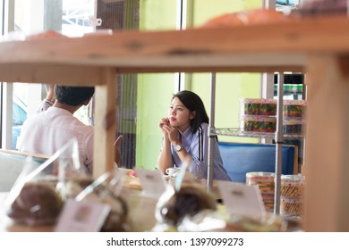 Happy Asian Family, With One Todler Spending Time Together Inside Bakery Store And Cafe Eating Cake, Family Bonding Time