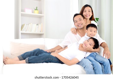 Happy Asian Family Parent Spending Time With Their Children During Coronavirus Pandemic Time.