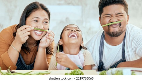 Happy Asian Family, Play Vegetables Kitchen In Portrait And Smile Together At Table For Bonding Time. Mom Dad, Child Happiness In Comic Home And Health Food In Nutrition Diet, Dinner And Kid Cooking