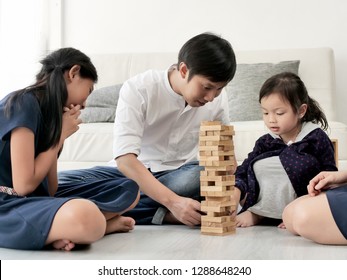 Happy Asian Family Playing Wooden Blocks Together At Home, Lifestyle Concept.