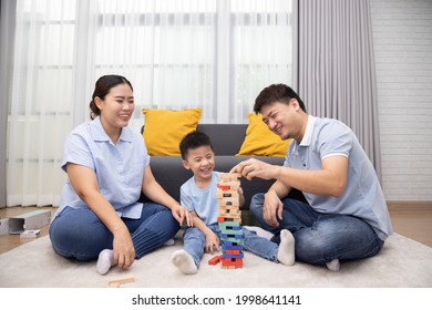 Happy Asian Family Playing With Wooden Bricks In Living Room, Lifestyle Relaxing At Home Concept