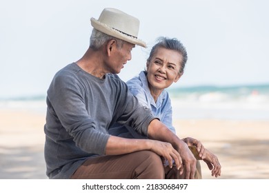Happy Asian Family, Senior Couple Sitting On Chairs With Backs On Beach Travel Vacation Talking Together, Romantic Elderly Enjoy Travel Summer Vacation, Plan Life Insurance Retirement Couple Concept