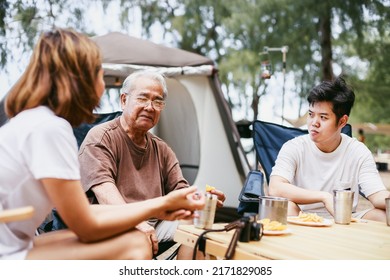 Happy Asian Family With A Senior Grandfather Picnic And Camping On Tropical Beach. Summer Activity. Relax And Outdoor Activity Lifestyle Family Concept.