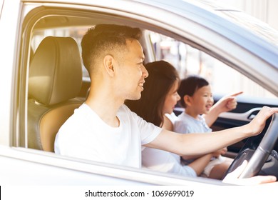 Happy Asian Family Is Smiling And Travelling On The Road Trip, Going For A Drive For Vacation