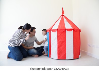 Happy Asian Family And Son Playing With Castle Tent In The Room At Home Having Fun Together And Smiling