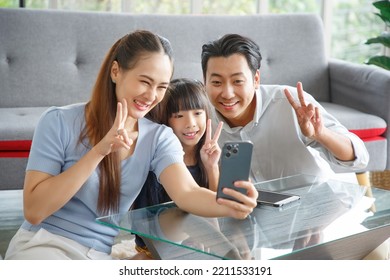 Happy Asian Family Taking Selfie At Home.Family,love And Happiness Concept.