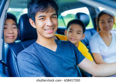 Happy Asian Family With The Trip In Car 