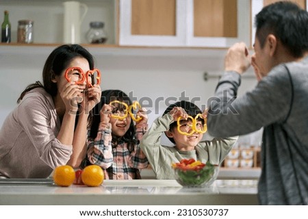 happy asian family with two children having fun together in kitchen at home Stock photo © 