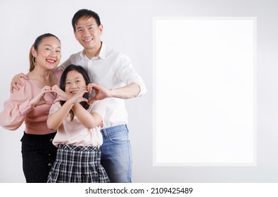 Happy Asian Family Woman And A Man With Junior Girl Smiling And Fun In The White Background, Lovely Family, Save With Clipping Path Only White Frame.