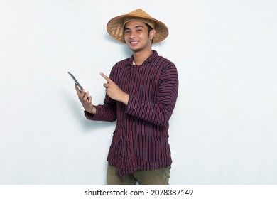 happy asian farmer using smartphone isolated on white background - Powered by Shutterstock