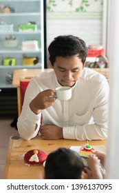 Happy Asian Father And His Todler Spending Time Together Inside A Cake Store And Cafe In The Morning