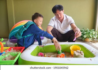 Happy Asian Father And Son Are Playing With Sand At Home, Little Kid Playing With Sand Toys, Montessori Education, Creative Play For Kids, Quarantine With Small Kids, Selective Focus At Kid