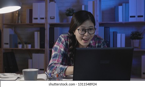 happy asian female student in glasses close up looking at monitor of laptop computer reading jump out good news on screen cheerfully laughing. joyful college girl staring notebook with excited face - Shutterstock ID 1311548924