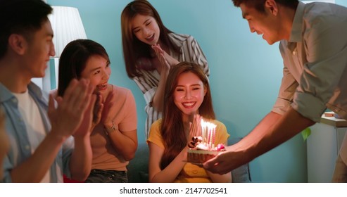 Happy Asian Friends Celebrating Surprise Birthday Party Give Cake With Candles To Woman And Clap In Room