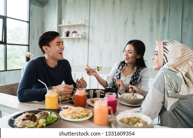 Happy Asian Friends Having Lunch Together In The Working Business Break