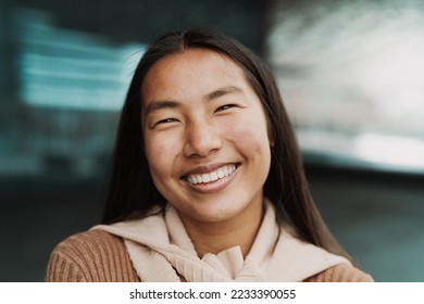 Happy Asian girl having fun posing and smiling in front of camera - Shutterstock ID 2233390055