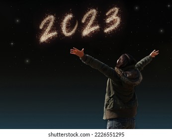 happy Asian girl open arm with joyful on countdown night with firework light for 2023 year. image of happy new year celebration party for seasonal and holiday background wallpaper - Shutterstock ID 2226551295