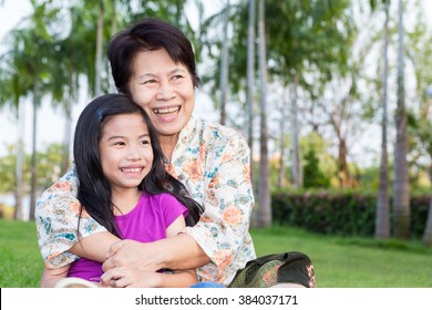 Happy Asian Grandma And Grandchild Smiling