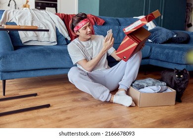 Happy Asian Guy Making Photo Of New Shoes