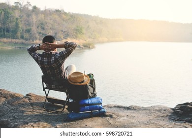 Happy Asian hipster man backpack in nature background, Relax time on holiday concept travel , color of vintage tone and soft focus - Shutterstock ID 598720721