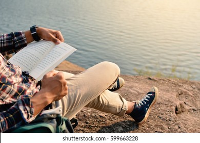 Happy Asian Hipster Man Reading A Book In Nature Background, Relax Time On Holiday Concept Travel , Color Of Vintage Tone And Soft Focus