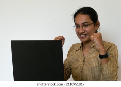 A Happy Asian Indian Woman Employee Or Business Woman In Front Of Laptop. IT, Corporate, Promotion, Job, Switch, Appraisal, Feedback, Manager, Offer Letter, Attrition, Excitement, Resignation, Success