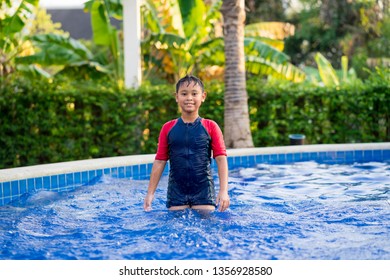 Happy Asian Kid Boy Swiming On Swiming Pool In The Summer