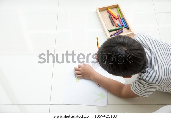 Happy Asian Kid Lying Down On Stock Photo Edit Now 1059421109