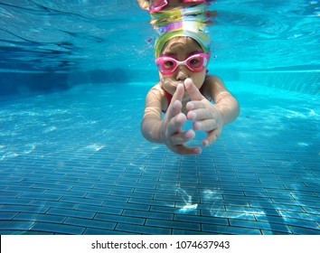 Happy Asian Kid Swimming Underwater In Summer. Outdoor Activities In Swimming Pool. Zoom Motion In Pool