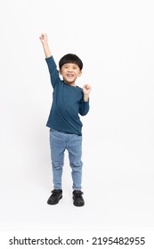 Happy Asian little boy hands up raised arms from happiness isolated on white background, Excited kid winner success concept, Looking at camera and full body composition