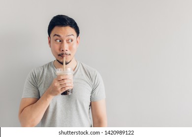 Happy Asian Man Is Drinking Bubble Milk Tea Or Pearl Milk Tea. Popular Milk Tea In Asia And Taiwan.