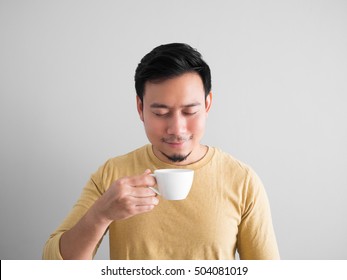 Happy Asian Man Feels Refresh By Drink And Smell A Cup Of Coffee.