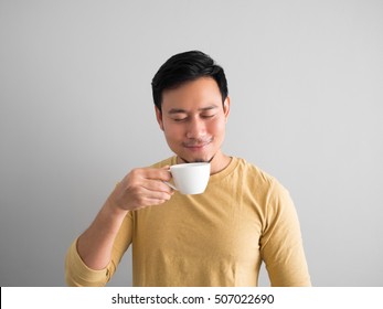 Happy Asian Man Feels Refresh By Drink And Smell A Cup Of Coffee.