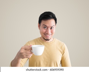 Happy Asian Man Feels Refresh By Drink And Smell A Cup Of Coffee Isolated On Cream Background.