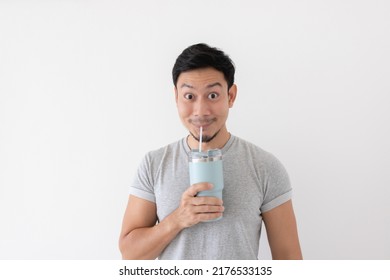 Happy Asian Man Has Cold Drink From Thermos Mug Isolated On White Background.