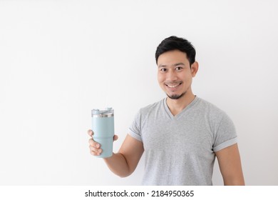 Happy Asian Man Has Cold Drink From Thermos Mug Isolated On White Background.