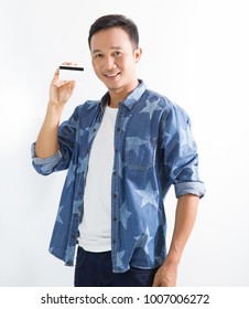 Happy Asian Man Holding  Card And Smiling Shopping Concept