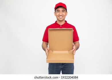 Happy Asian man in red t-shirt and cap holding empty pizza box isolated over white background, Delivery food service concept - Powered by Shutterstock