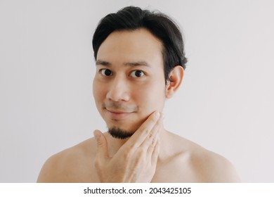 Happy Asian Man Show Off His Face Apply Skincare Product.