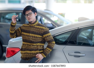 Happy Asian Men Who Buy New Cars In Showrooms And Happy Customers Just Bought Cars At Car Dealers.